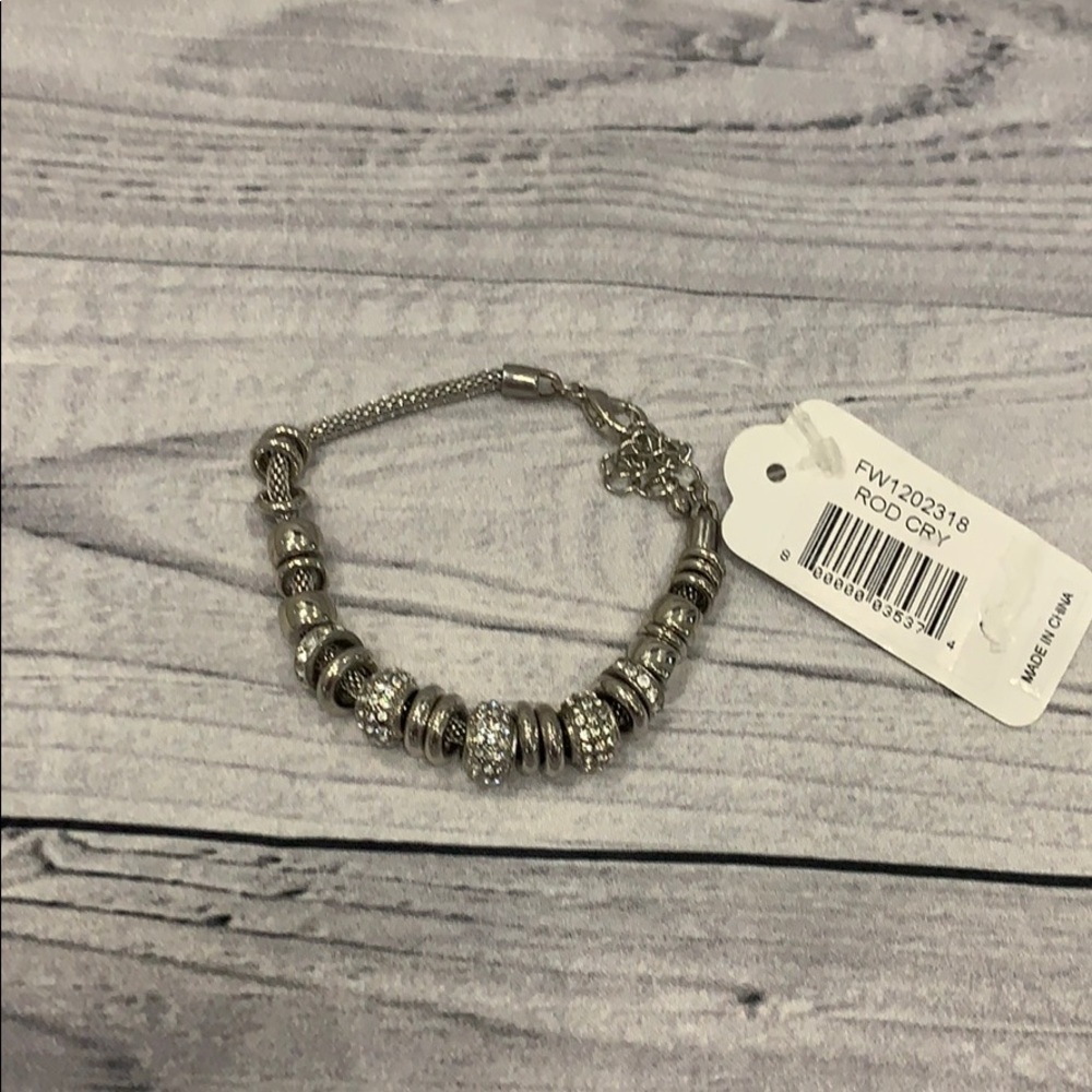 Silver tone(not sterling silver)Charm bracelet
